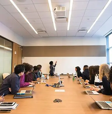 Business people meeting late in conference room