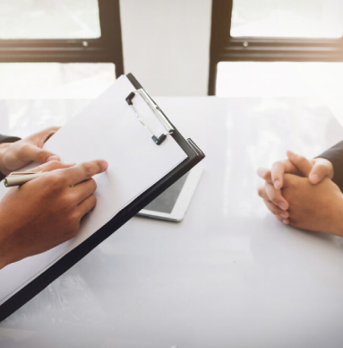 Two people going over a legal document